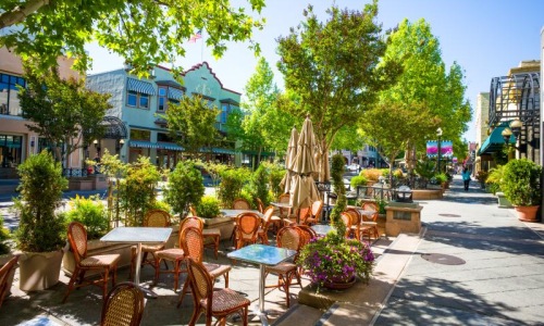 outdoor tables and chairs in front of local restaurant